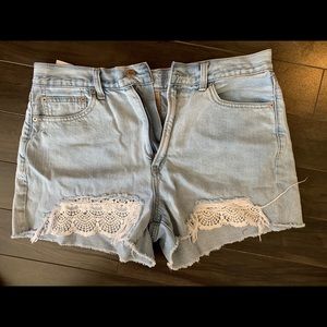 High rise faded jean shorts with lace detail